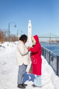 Josee and Olivia walking toward their Montreal Old Port proposal at the Clock Tower.