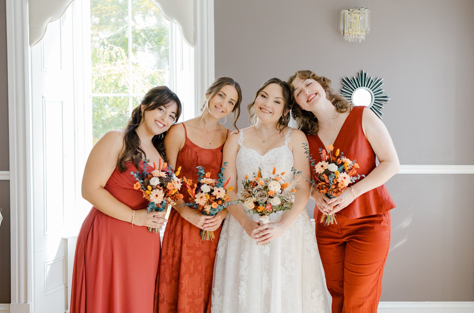 Montreal wedding party with bride and bridesmaids by a bright window